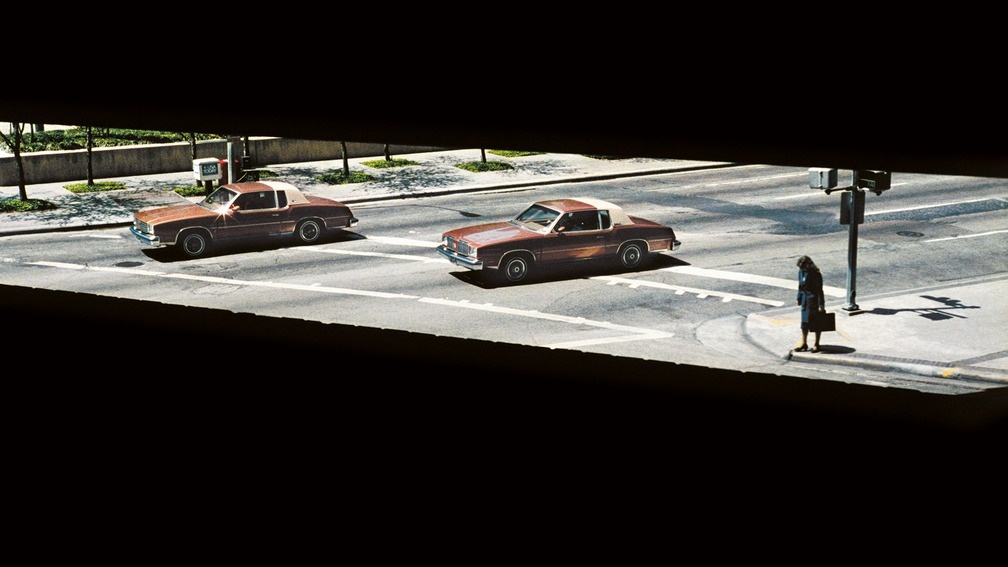 Two Cars and A Woman Waiting